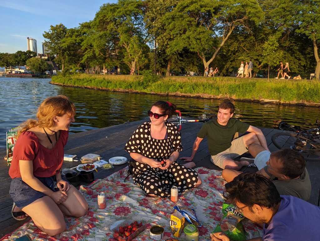 Members of the lab having a picnic on the Esplanade dock.