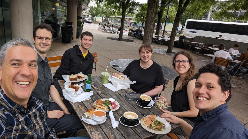 Members of the lab eating lunch outside at Tatte.