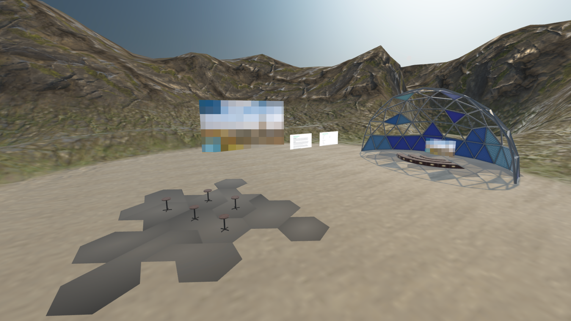 A three-dimensional virtual reality outdoor scene rendered in a game engine. Gray hexagonal floor tiles and small black posts occupy the foreground. A translucent blue display panel stands on the left and a blue geodesic dome structure is on the right, set against a mountain landscape.